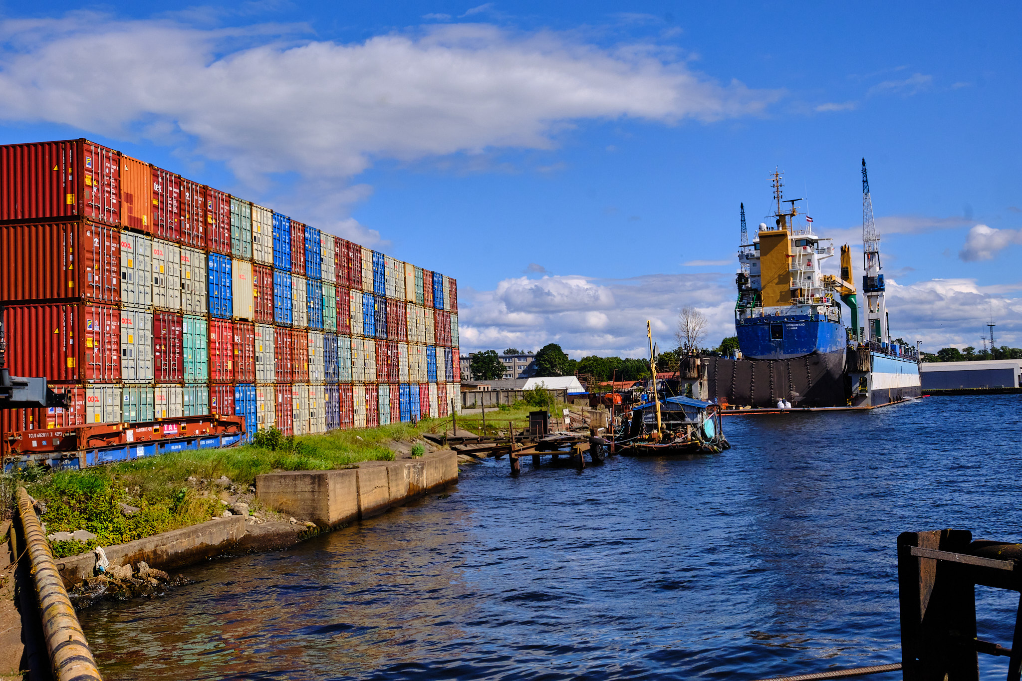 Container stacks and a cargo ship at a Baltic port