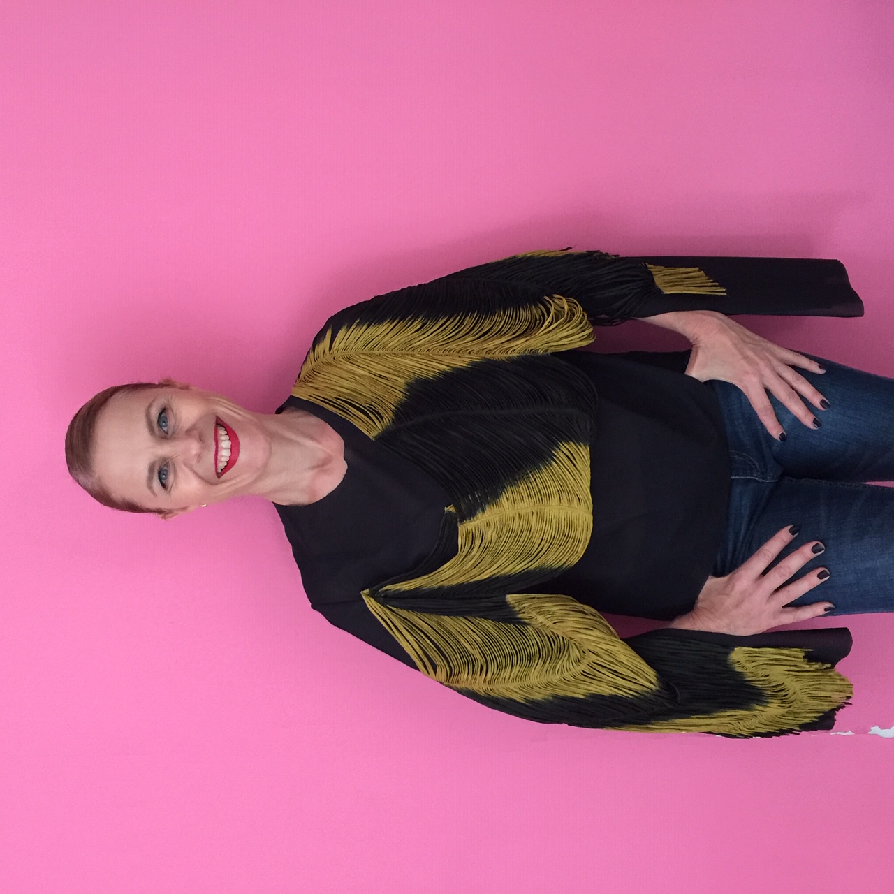 Portrait of trend analyst Susanna Björklund against a pink wall