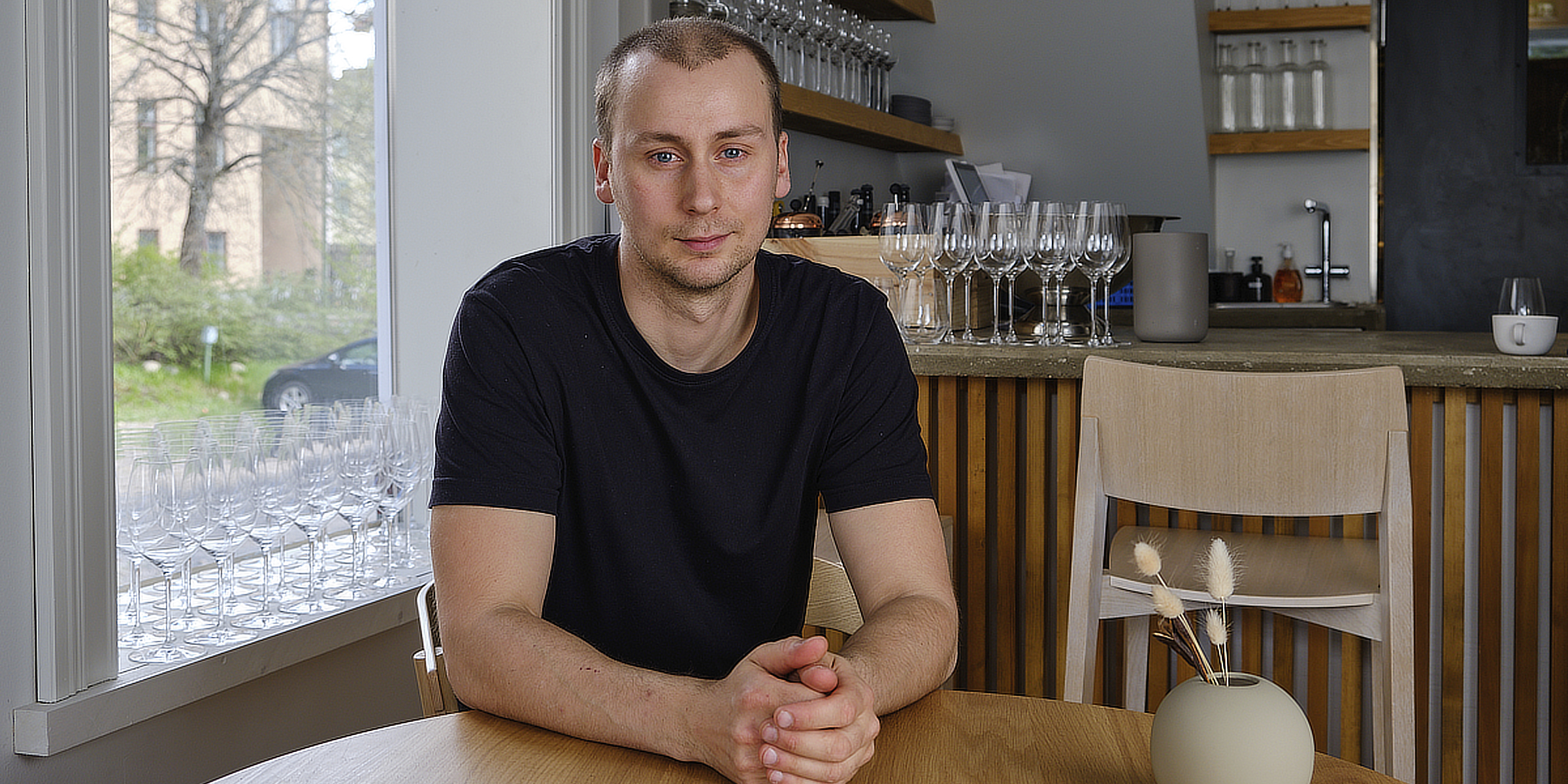 Chef Nico Lehto seated at a table in the Vår dining room, Helsinki