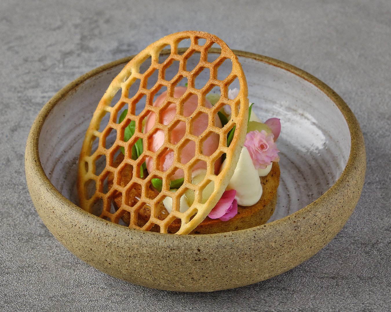 Vår dessert under a honeycomb tuile, photographed for chef Nico Lehto