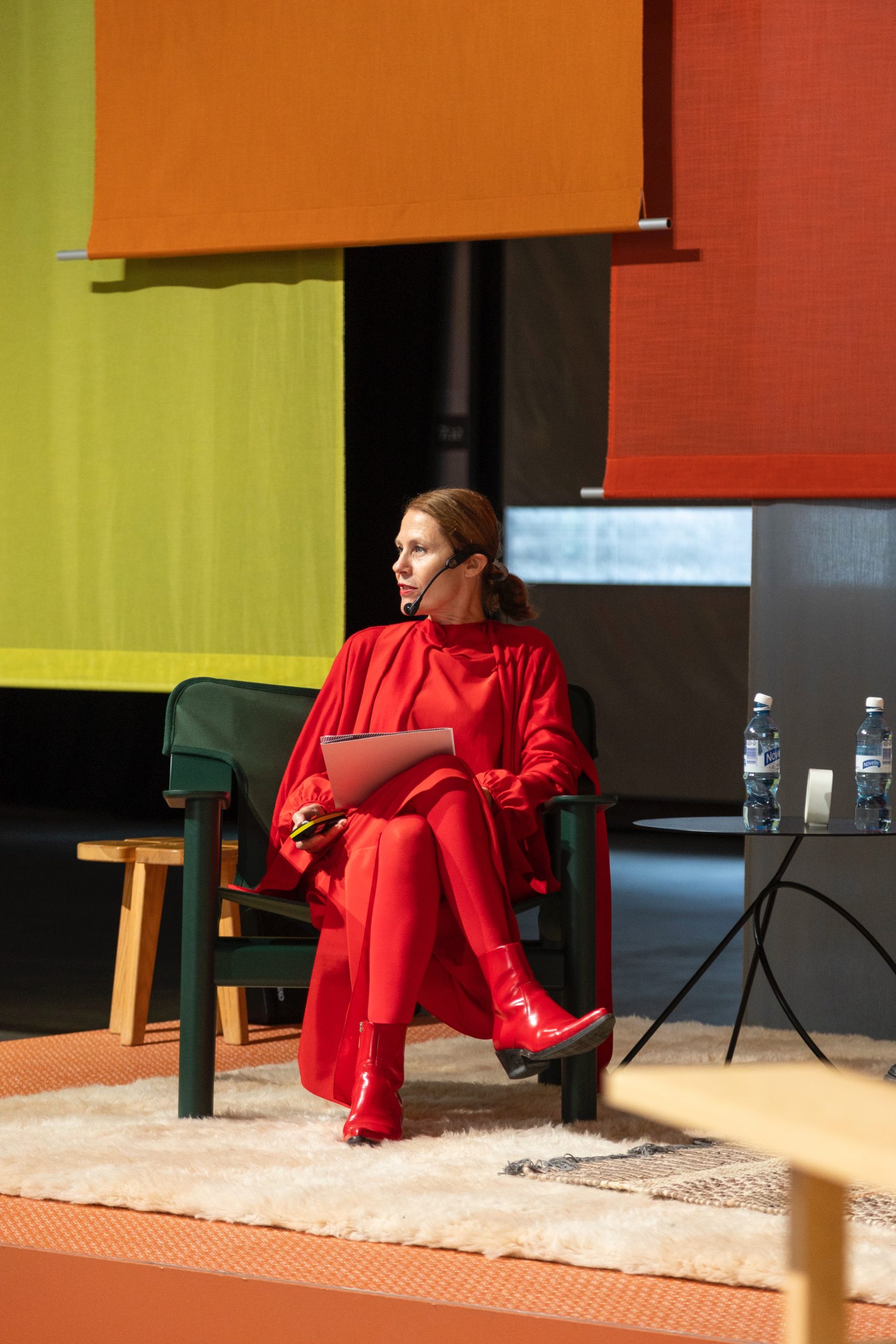 Susanna Björklund moderating a panel discussion on stage